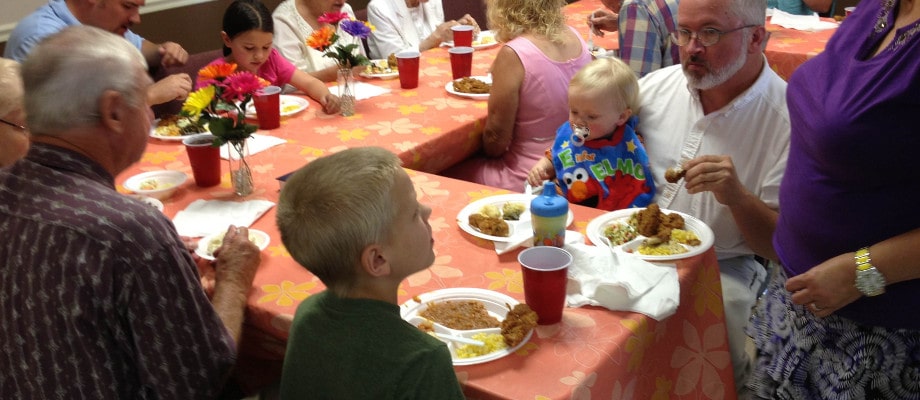 Tables set for a congregational meal